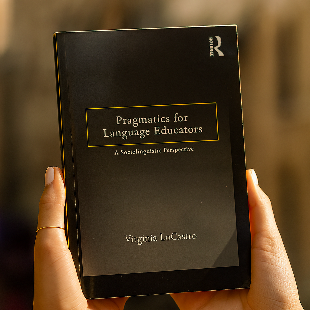 Book titled 'Pragmatics for Language Educators' held by a person with a blurred background